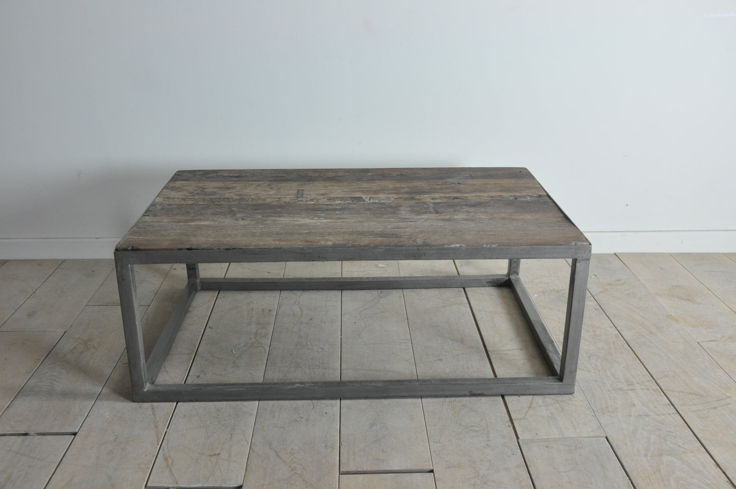 Rustic coffee table with metal base