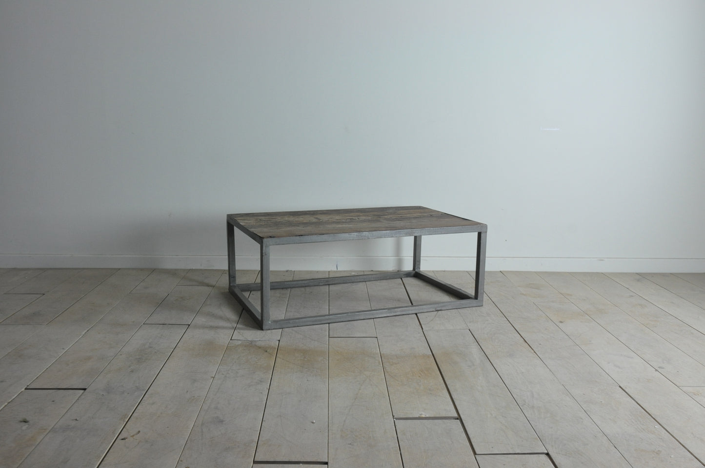 Rustic coffee table with metal base